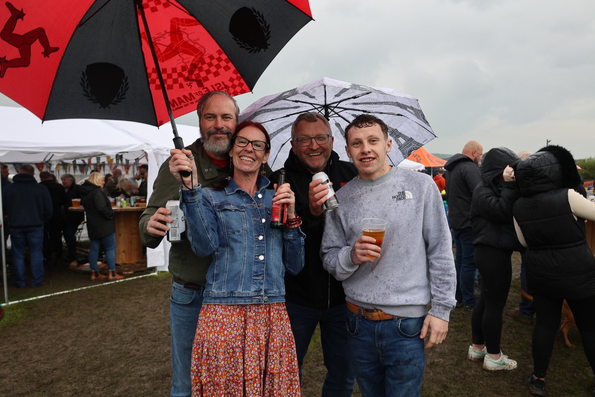 Friends enjoying CowFest in the rain